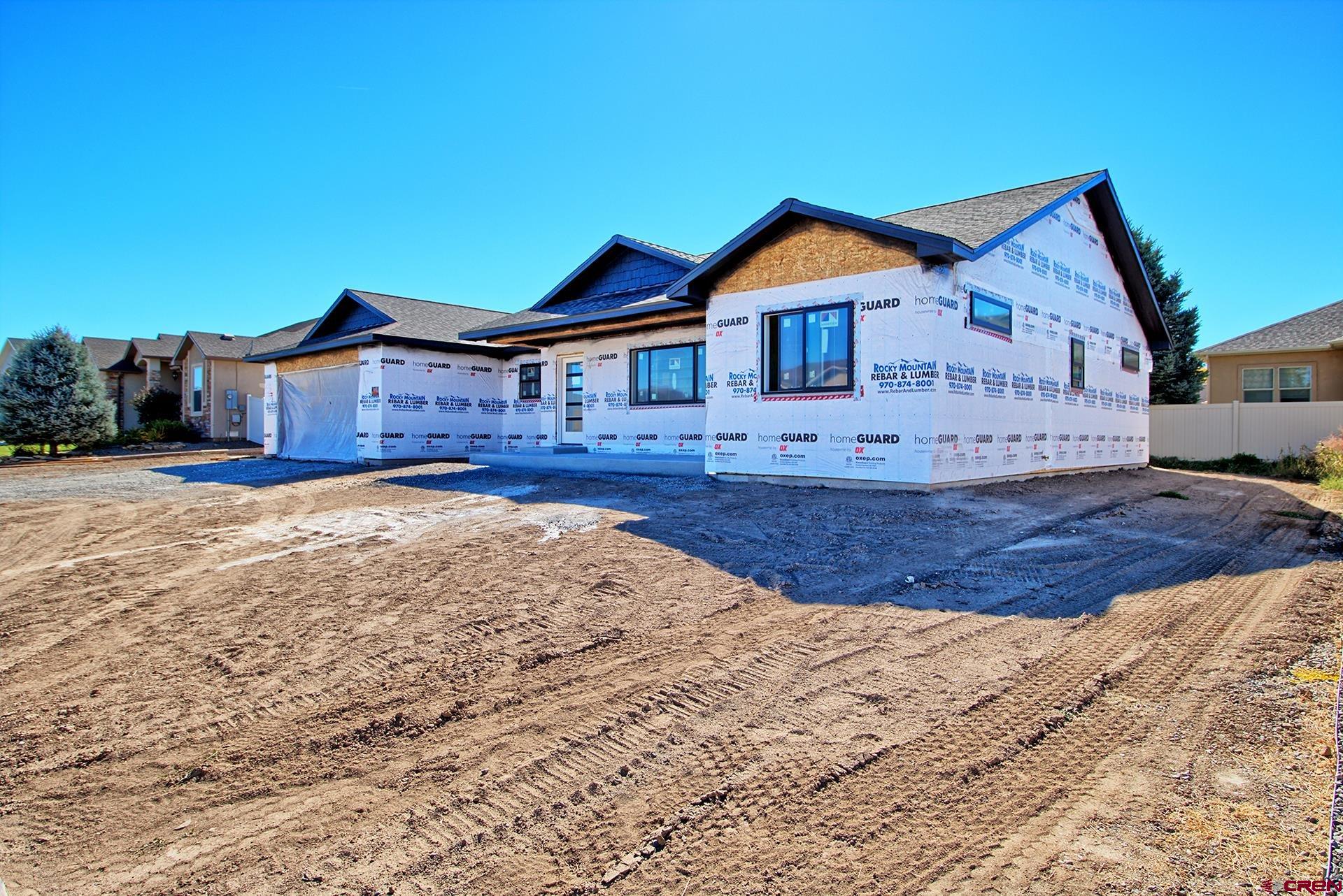 1746 Lynx Street Delta, CO 81416 - Photo 2 of 13 a view of a house with a yard