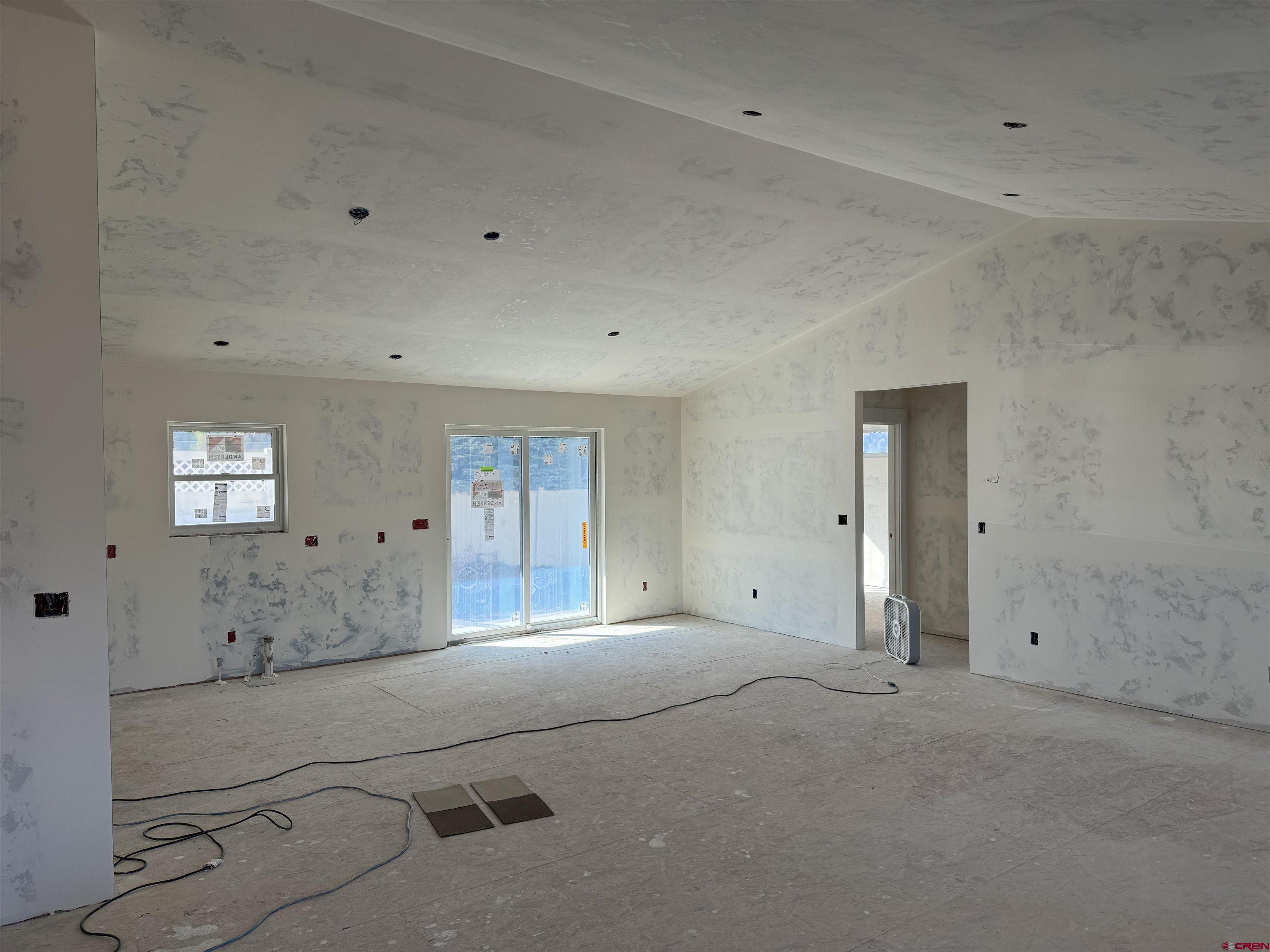 1746 Lynx Street Delta, CO 81416 - Photo 3 of 13 a spacious bathroom with a granite countertop sink and a mirror