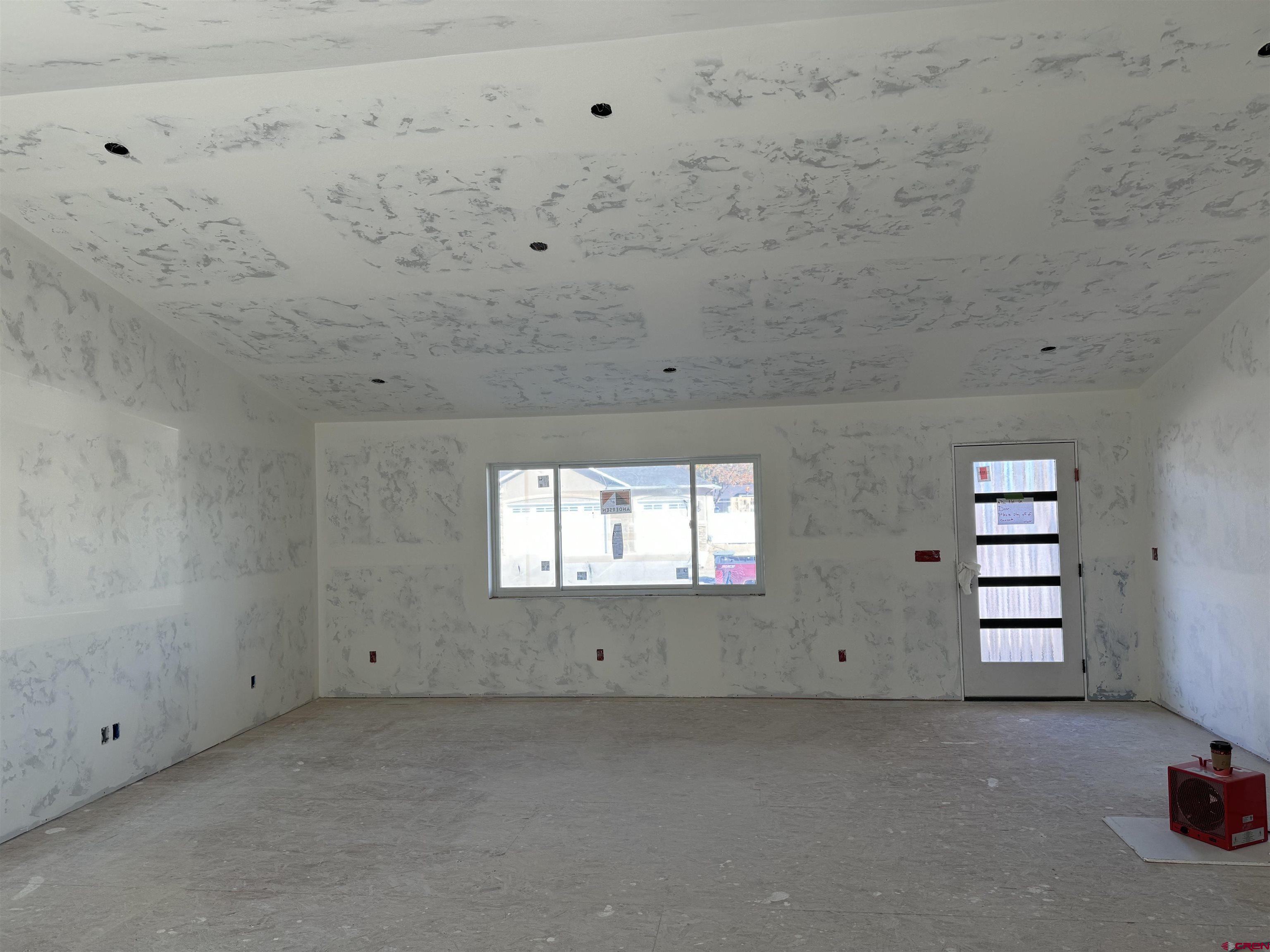 1746 Lynx Street Delta, CO 81416 - Photo 4 of 13 an empty room with windows