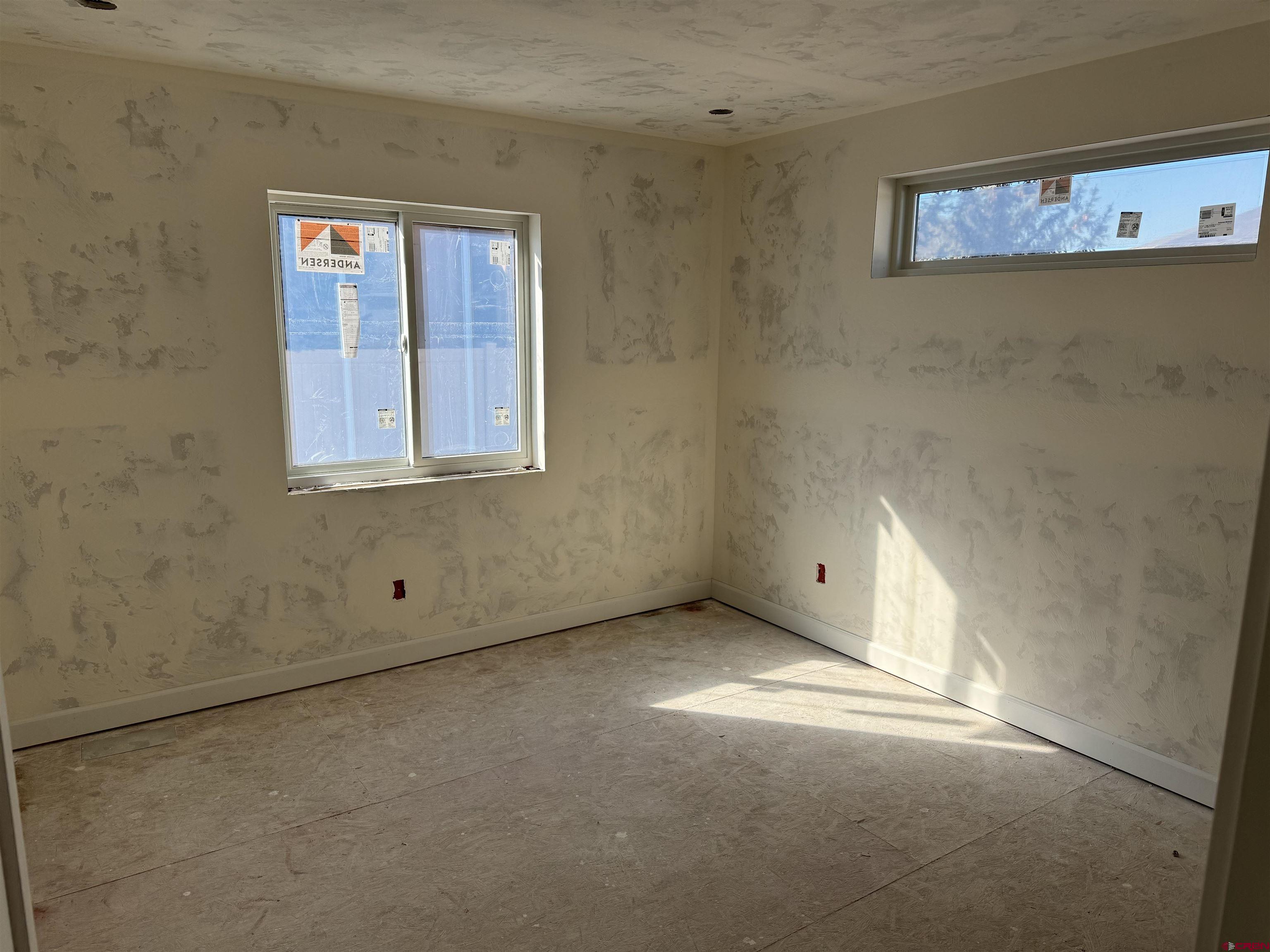 1746 Lynx Street Delta, CO 81416 - Photo 8 of 13 an empty room with windows