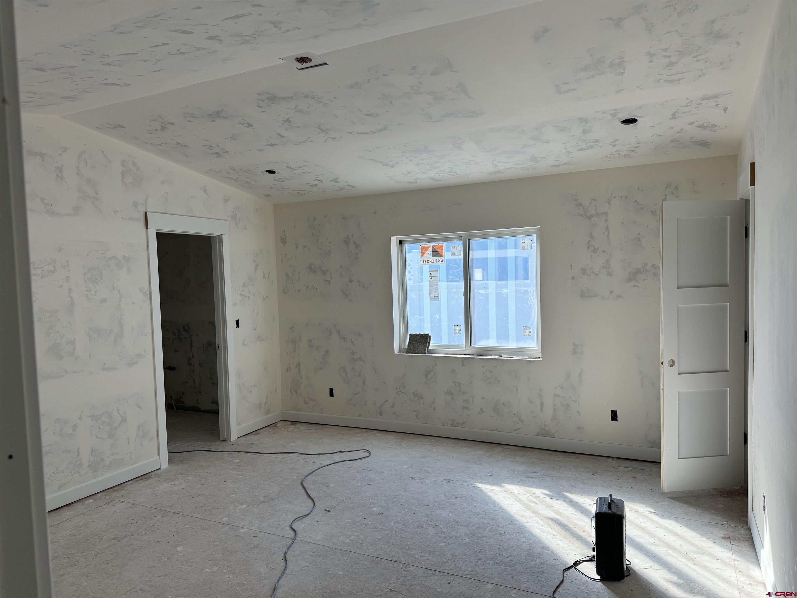 1746 Lynx Street Delta, CO 81416 - Photo 9 of 13 a view of an empty room with a window