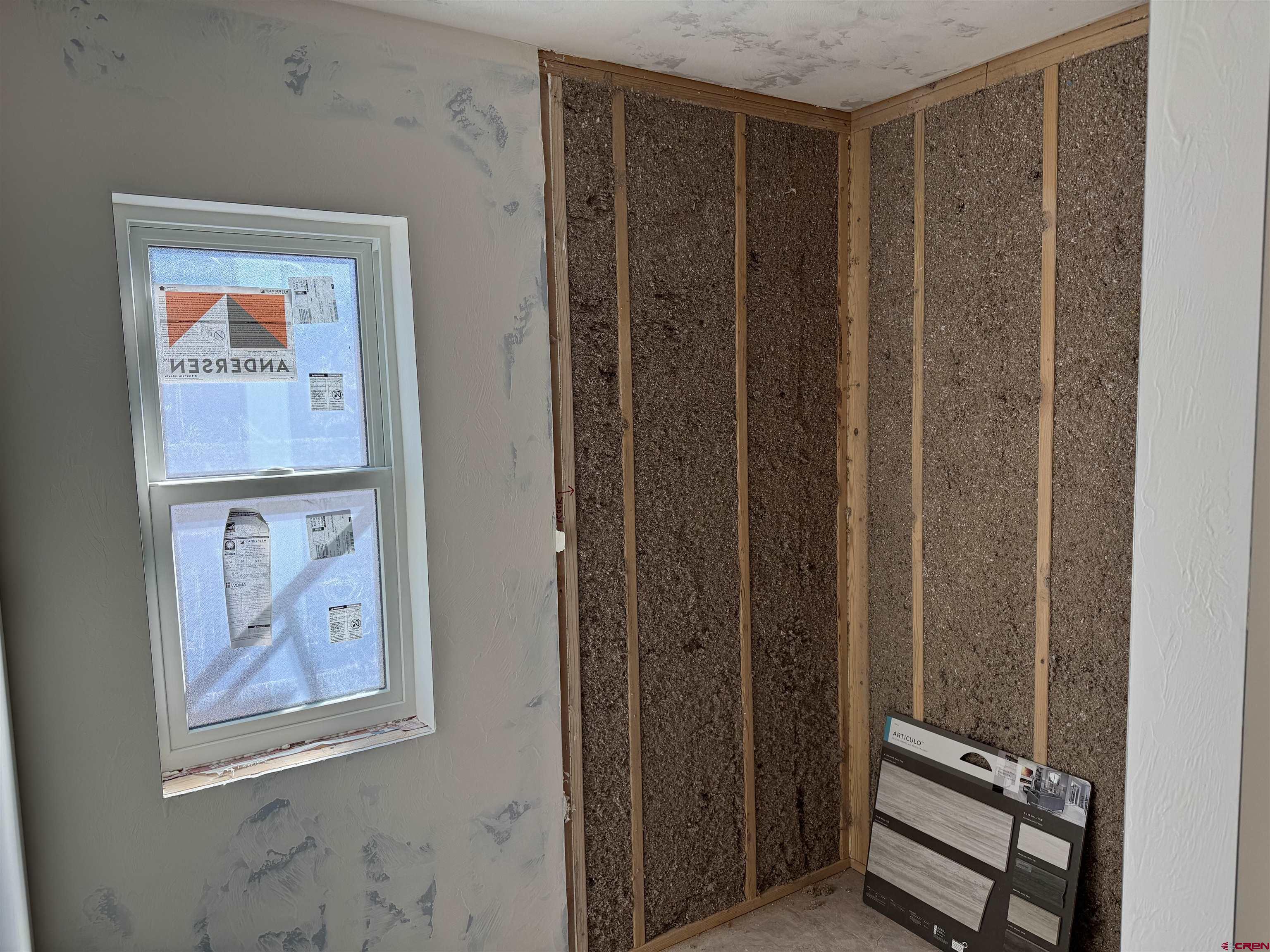 1746 Lynx Street Delta, CO 81416 - Photo 10 of 13 a view of a hallway with paintings on the wall