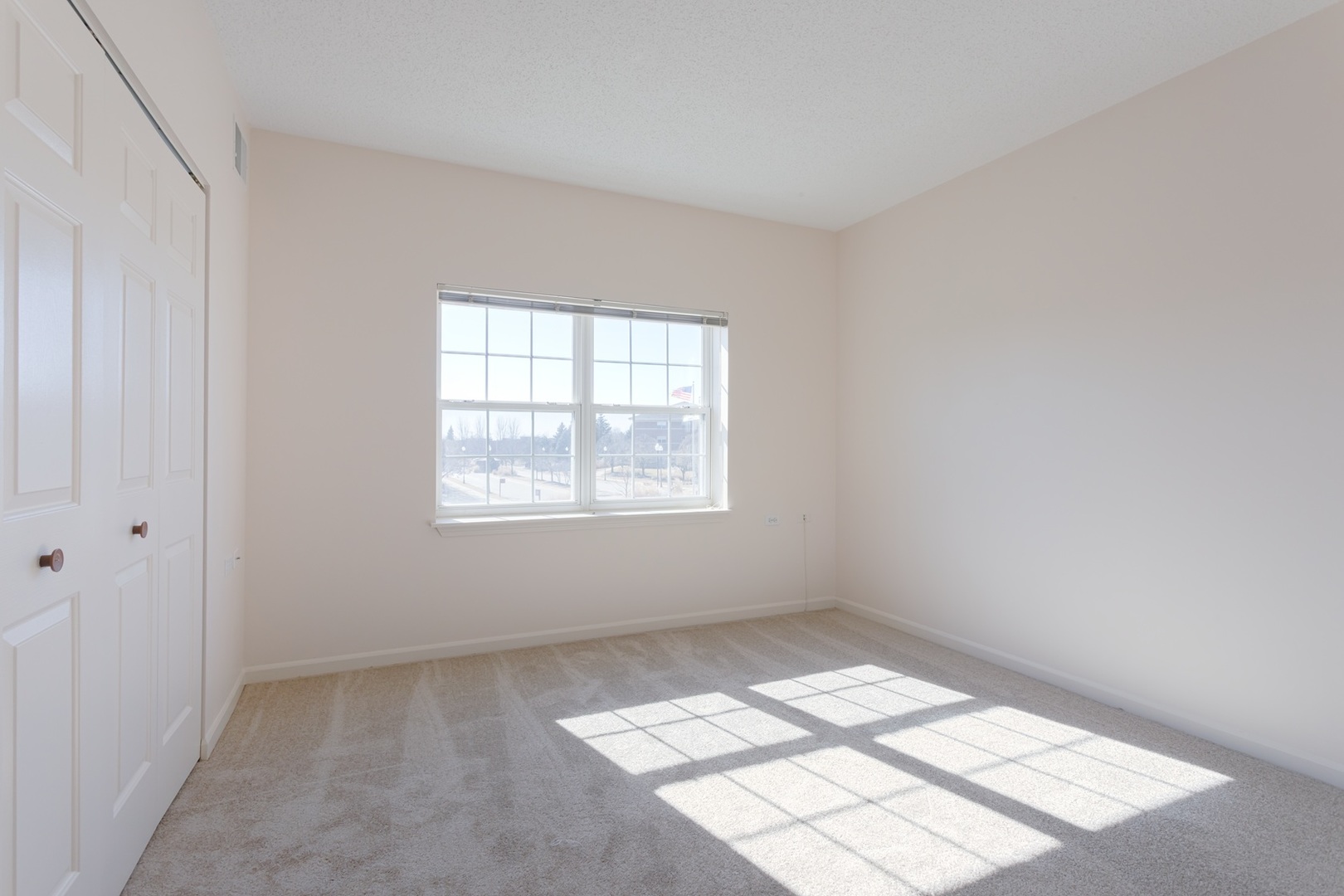 2000 Randi Drive, Unit 317 Aurora, IL 60504 - Photo 16 of 19 an empty room with a window
