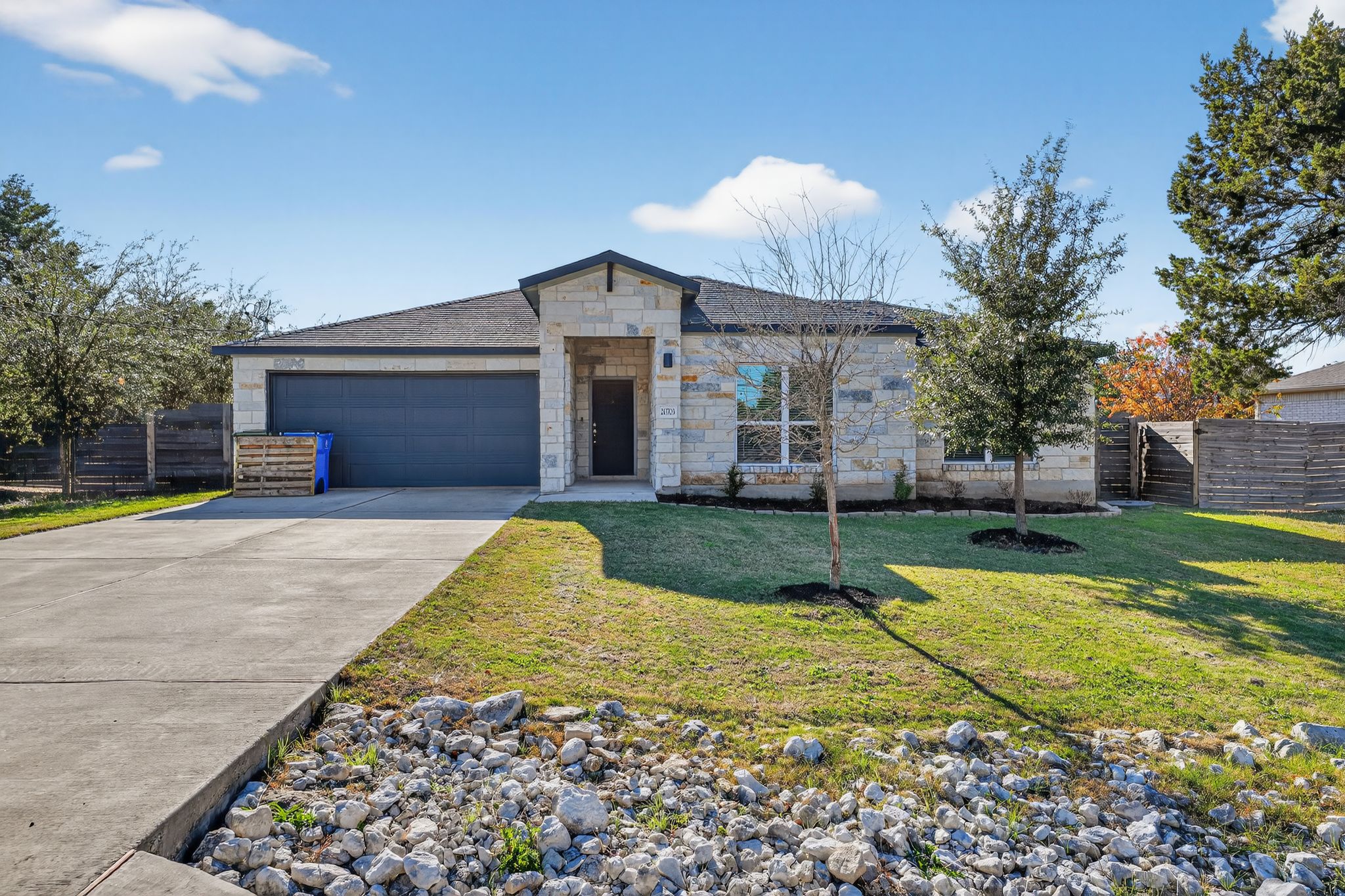 a view of a house with a swimming pool and a yard