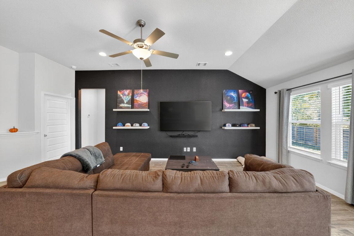 20703 Ridgeview Road Lago Vista, TX 78645 - Photo 11 of 30 a living room with furniture and a flat screen tv