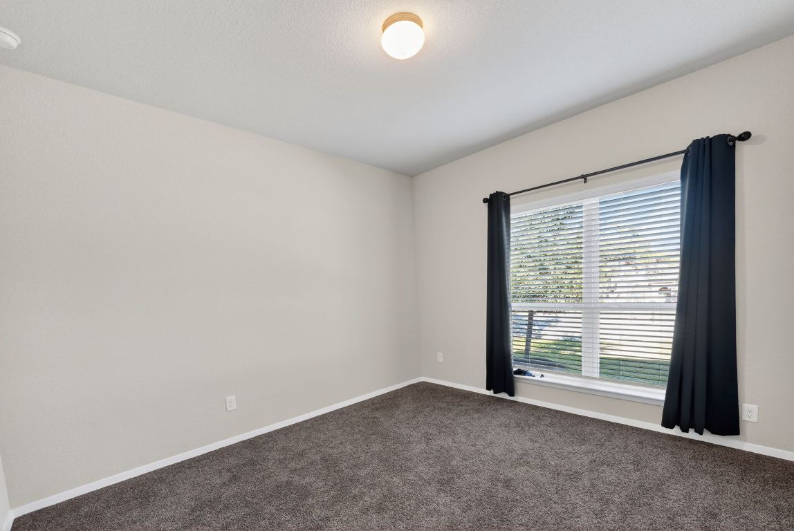 20703 Ridgeview Road Lago Vista, TX 78645 - Photo 21 of 30 a view of a livingroom with an empty space and a window