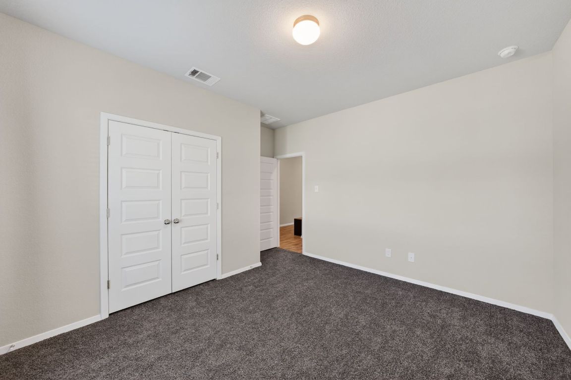 20703 Ridgeview Road Lago Vista, TX 78645 - Photo 22 of 30 an empty room with an entryway