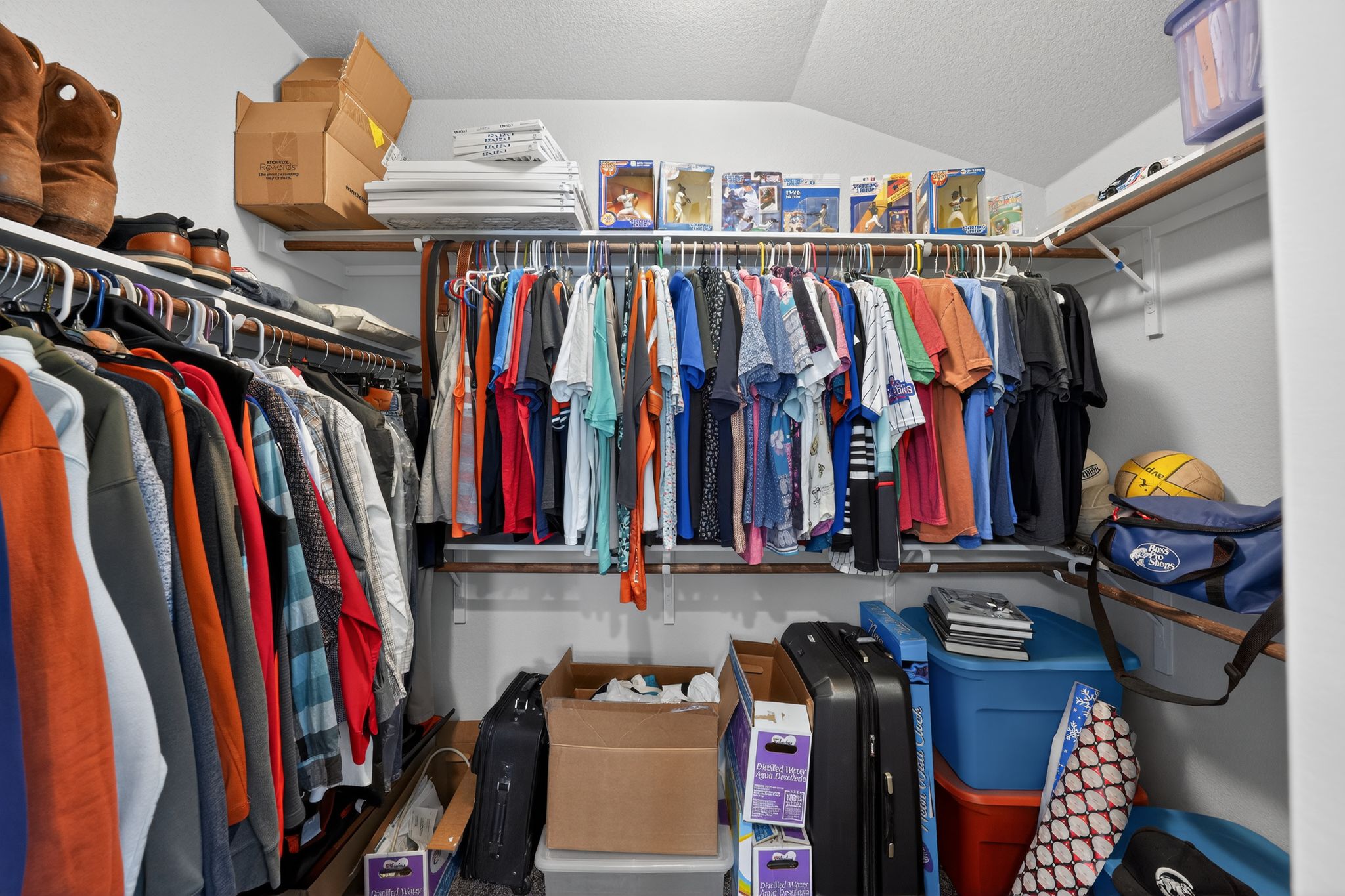 20703 Ridgeview Road Lago Vista, TX 78645 - Photo 26 of 30 a view of walk in closet with clothes and shoes