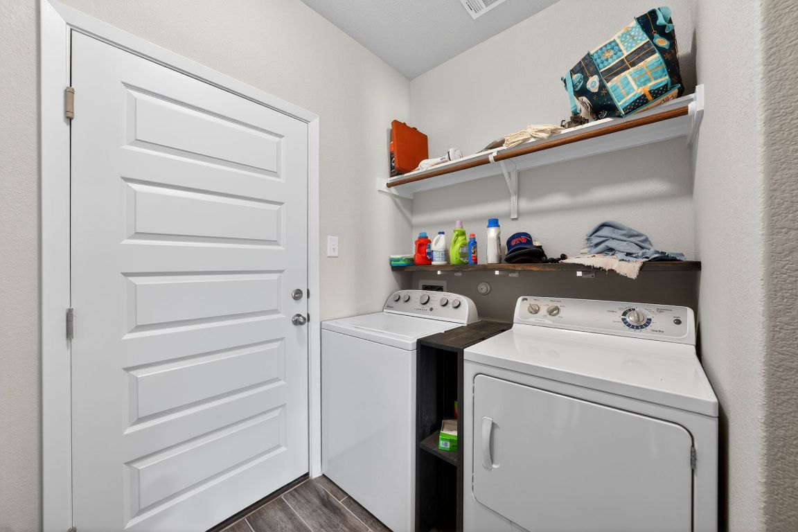 20703 Ridgeview Road Lago Vista, TX 78645 - Photo 30 of 30 a utility room with dryer and washer