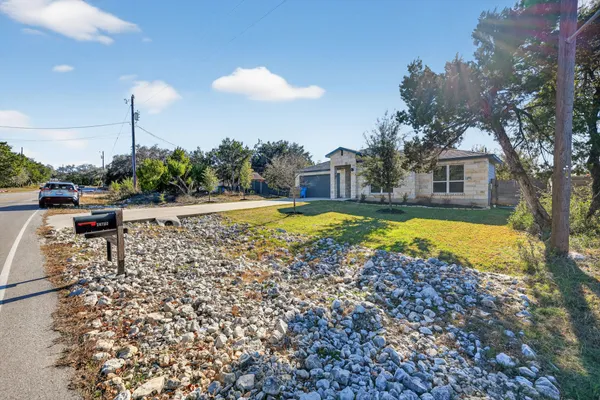 a view of a swimming pool and lounge chairs