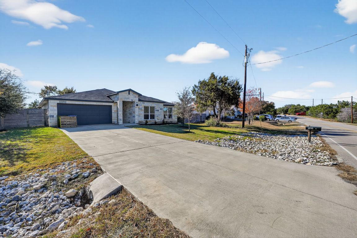 20703 Ridgeview Road Lago Vista, TX 78645 - Photo 4 of 30 a view of a house with a swimming pool