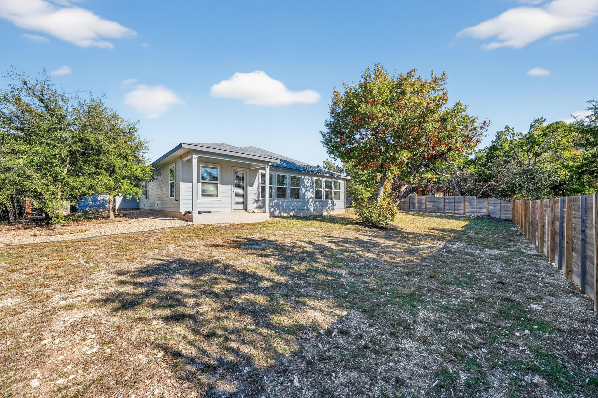 20703 Ridgeview Road Lago Vista, TX 78645 - Photo 6 of 30 a view of house with yard and trees in the background