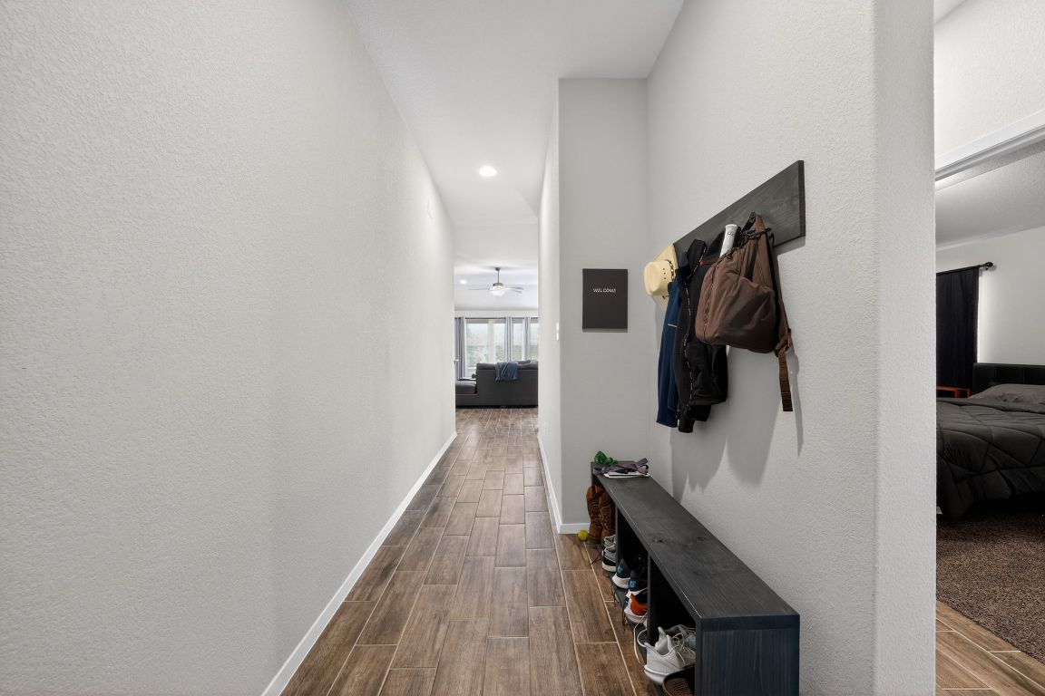 20703 Ridgeview Road Lago Vista, TX 78645 - Photo 9 of 30 a view of walk in closet with clothes and shoes