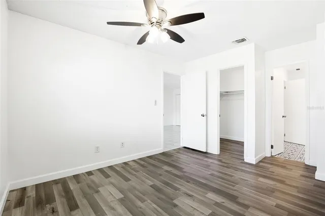 a bathroom with a sink a mirror a toilet and a shower