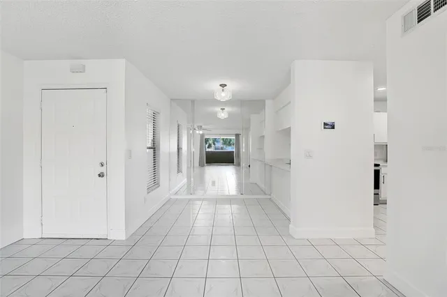 a view of a kitchen with sink and cabinet