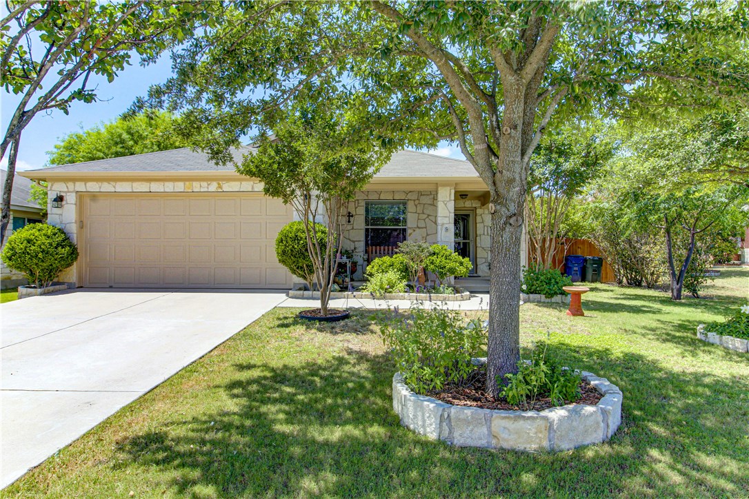 513 MacKenzie Way Leander, TX 78641 - Photo 1 of 1 a front view of a house with a yard