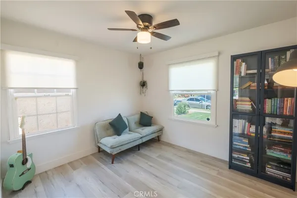 a living room with furniture and a window