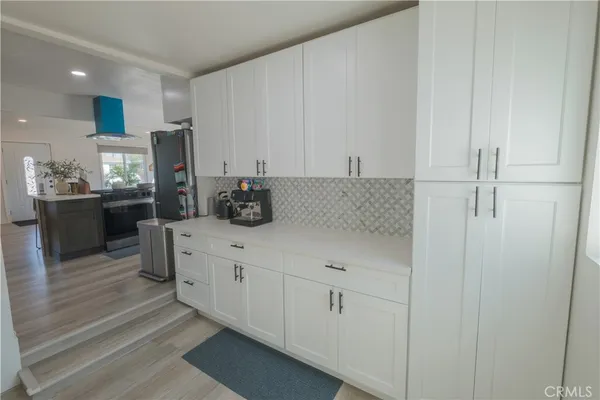 a kitchen with a sink and cabinets