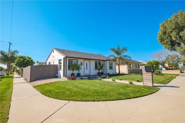 a view of a house with a backyard porch and sitting area