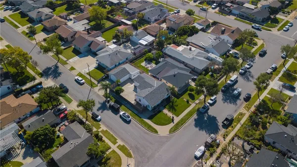 an aerial view of multiple houses with yard