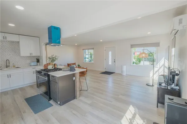a kitchen with a sink cabinets and window