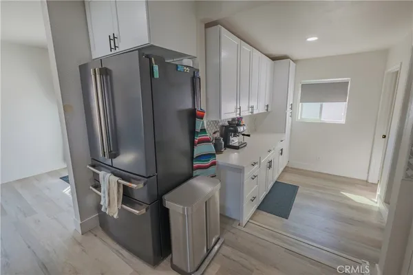 a kitchen with stainless steel appliances a refrigerator and a stove