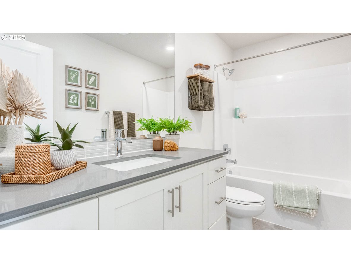 2150 36th Avenue Forest Grove, OR 97116 - Photo 17 of 24 a bathroom with a sink a toilet and shower