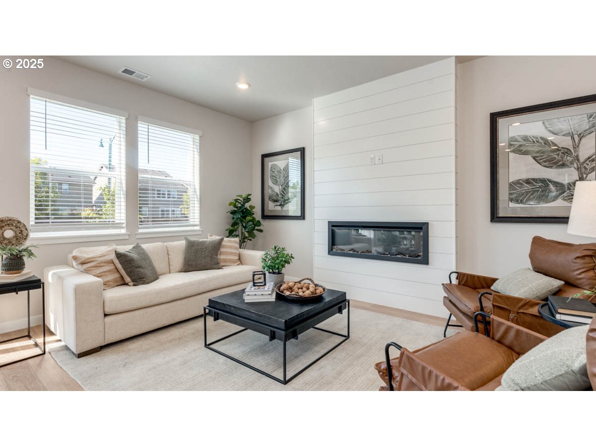 2150 36th Avenue Forest Grove, OR 97116 - Photo 5 of 24 a living room with furniture a flat screen tv and a large window
