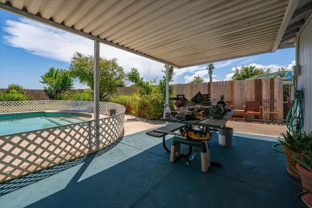 a view of a swimming pool with a yard