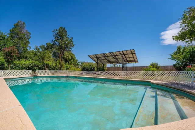 a view of a backyard of the house