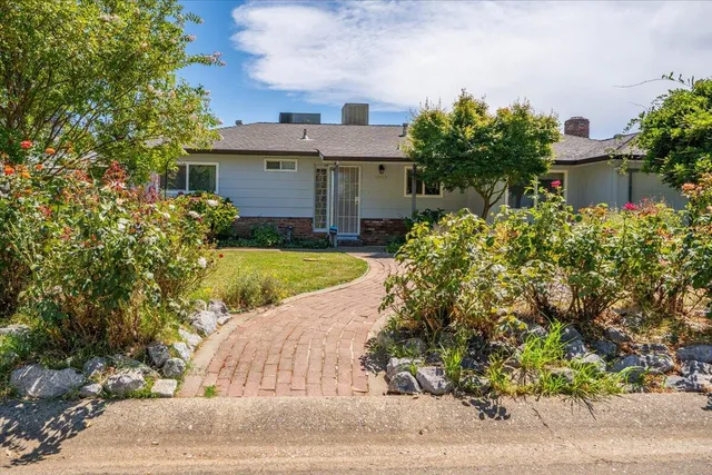 front view of a house with a yard