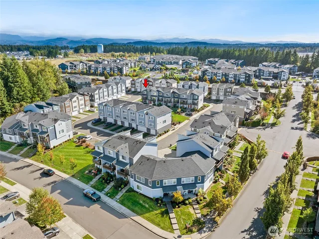 an aerial view of a house with a ocean view