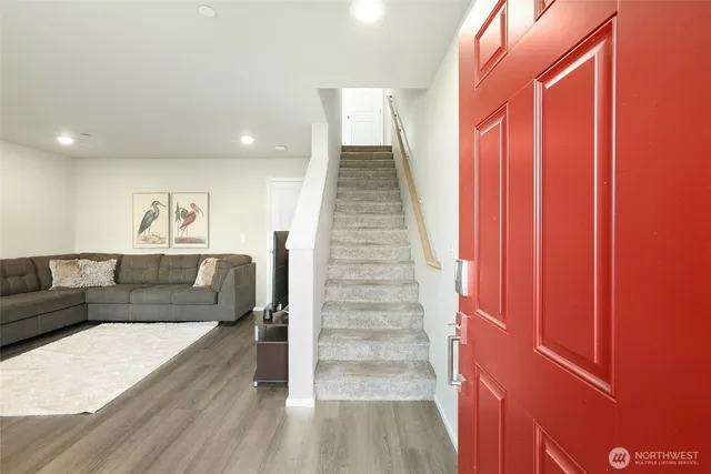 a view of entryway with wooden floor