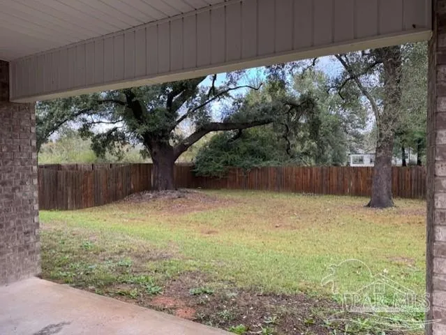 a backyard of a house with lots of green space