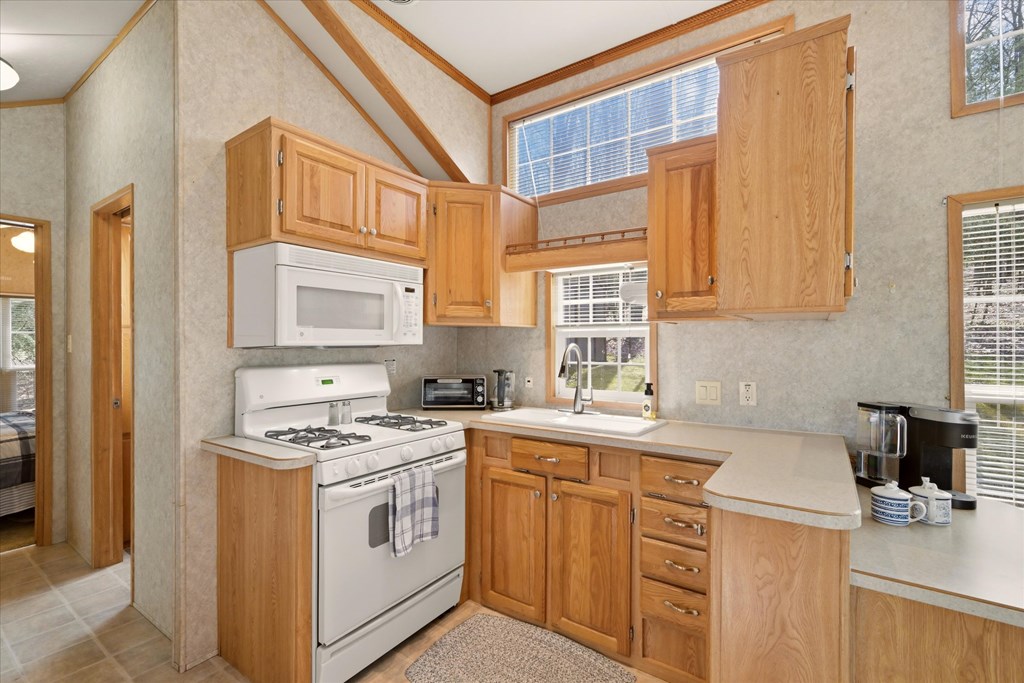 356 German Hill Road Tionesta, PA 16353 - Photo 7 of 37 a kitchen with cabinets appliances a sink and a window