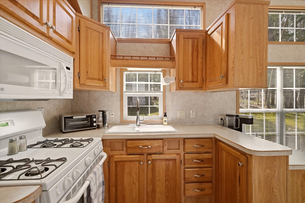 356 German Hill Road Tionesta, PA 16353 - Photo 9 of 37 a kitchen with granite countertop a sink stove and cabinets