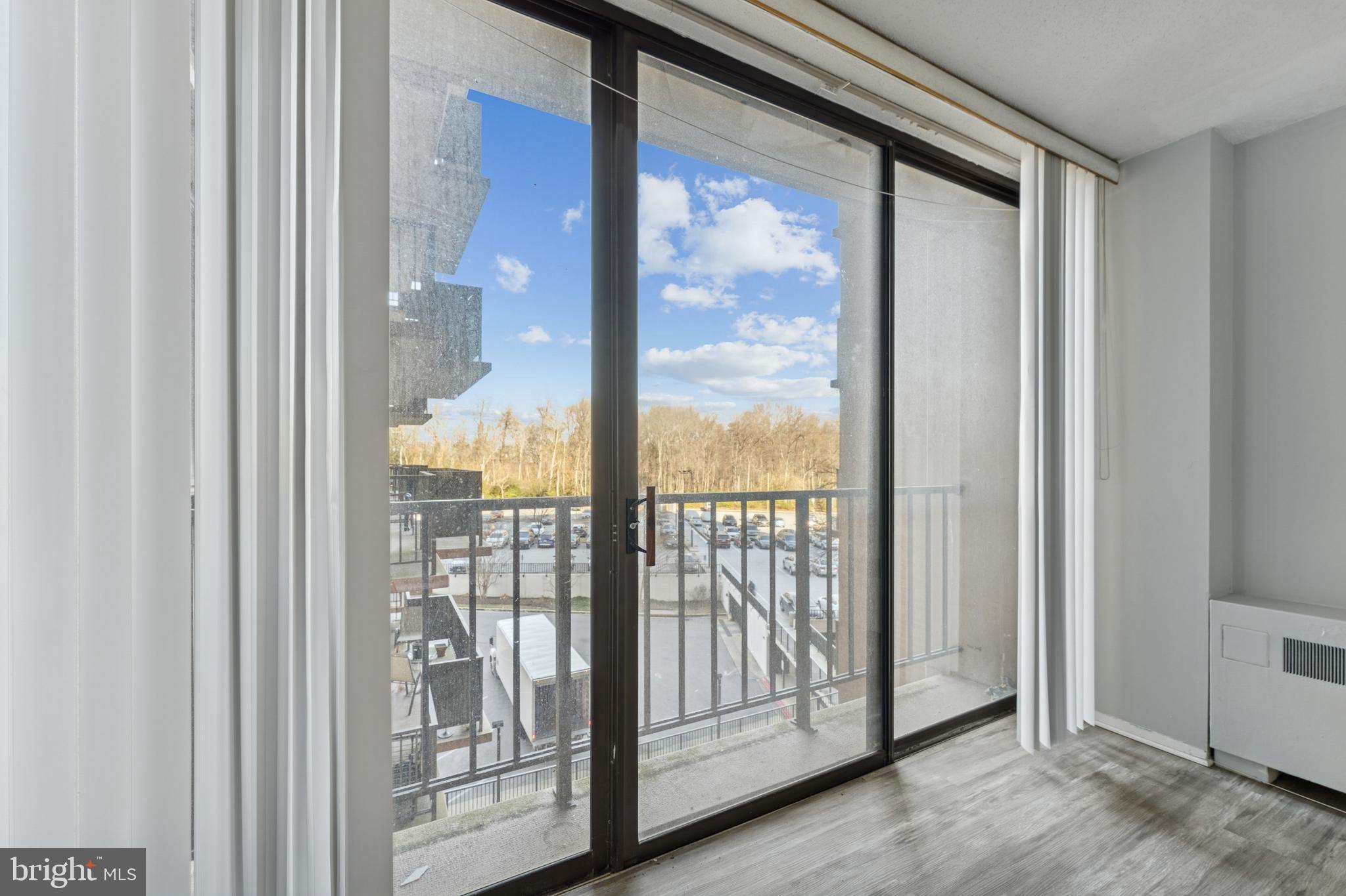 6100 Westchester Park Drive, Unit 520 College Park, MD 20740 - Photo 14 of 15 a view of a glass door with a door