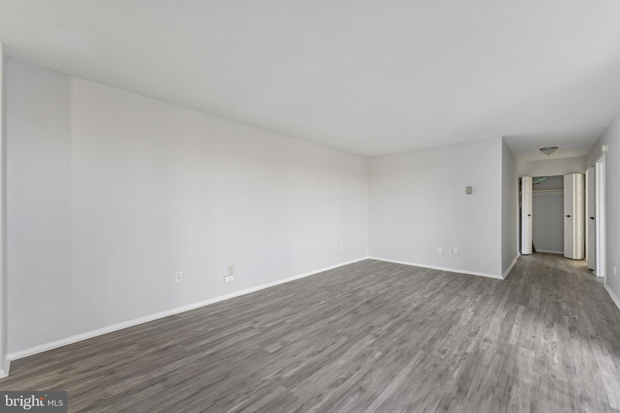 6100 Westchester Park Drive, Unit 520 College Park, MD 20740 - Photo 8 of 15 a view of an empty room and wooden floor