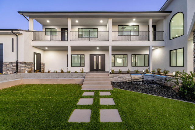 476 Spring Drive Toquerville, UT 84774 - Photo 6 of 95 Rear view of house featuring stucco siding, french doors, and a yard