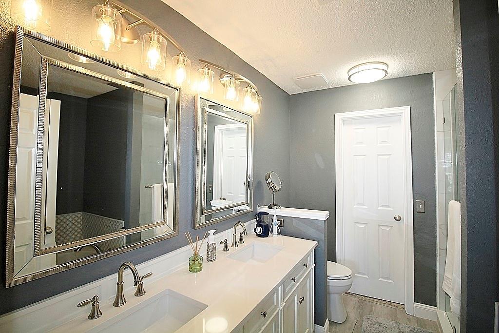 314 Pool Street Cedar Hill, TX 75104 - Photo 13 of 25 a bathroom with a sink and a mirror