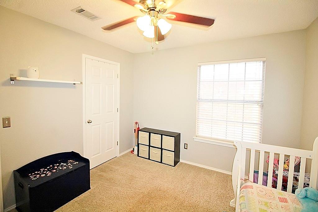 314 Pool Street Cedar Hill, TX 75104 - Photo 20 of 25 a bedroom with a bed and a window