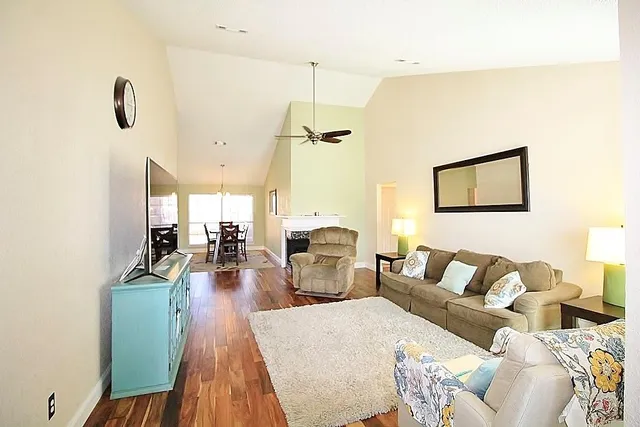 a living room with furniture and a table