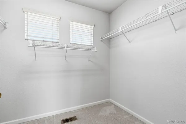 a view of a room with racks on the wall