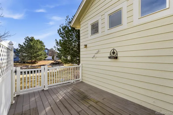 a view of a balcony with wooden floor