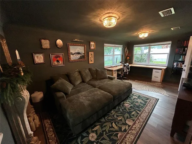 a living room with furniture and a couch