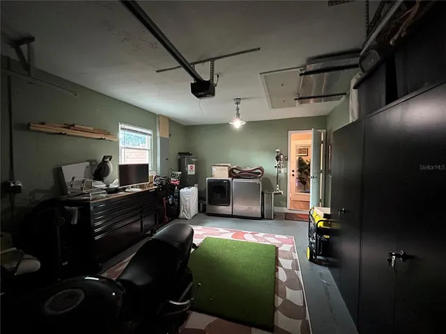 a kitchen with sink refrigerator and window