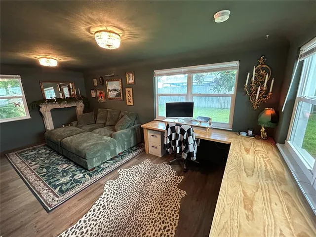 a living room with furniture and a rug