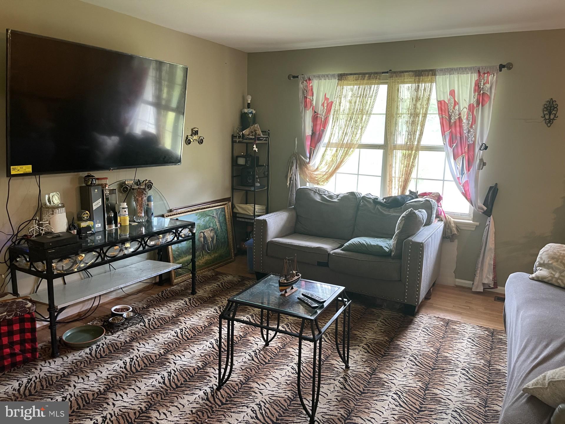 12574 Bristow Road Nokesville, VA 20181 - Photo 12 of 38 a living room with furniture and a flat screen tv