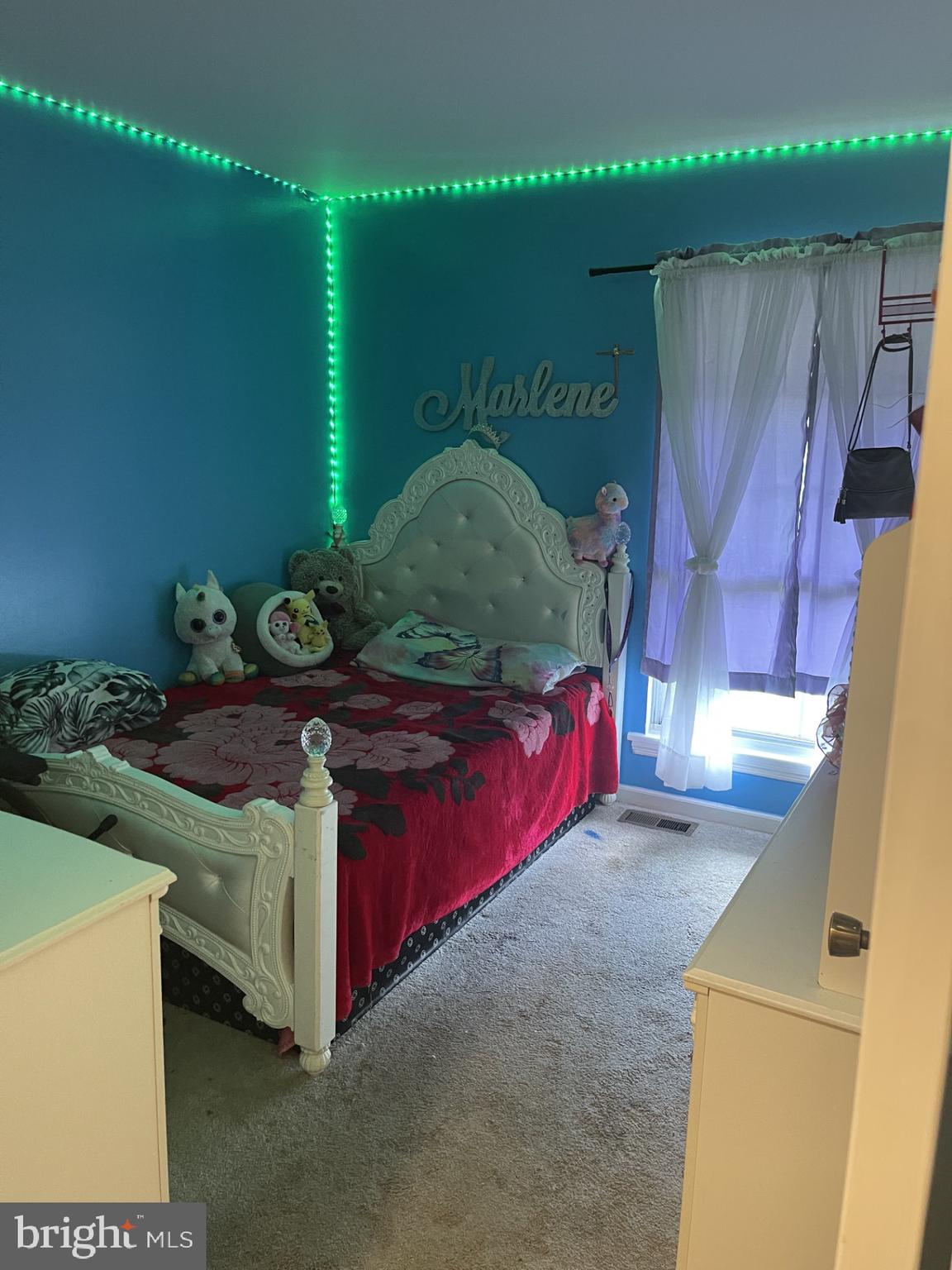 12574 Bristow Road Nokesville, VA 20181 - Photo 16 of 38 a bed sitting in a room next to a window