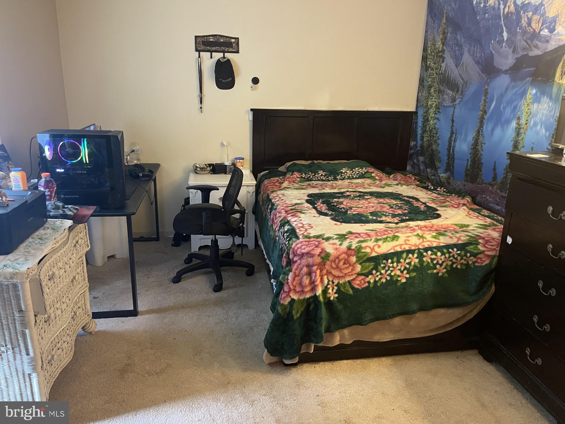 12574 Bristow Road Nokesville, VA 20181 - Photo 19 of 38 a bed sitting in a bedroom next to a window